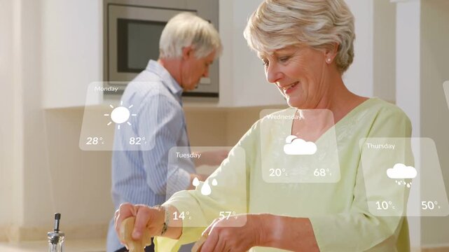 woman cooking, tossing salad on island with phone-triggered weather overlay appearing, man smiling