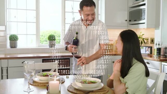 Man approaching table, pouring wine into glass, starting dinner while binary overlay over couple