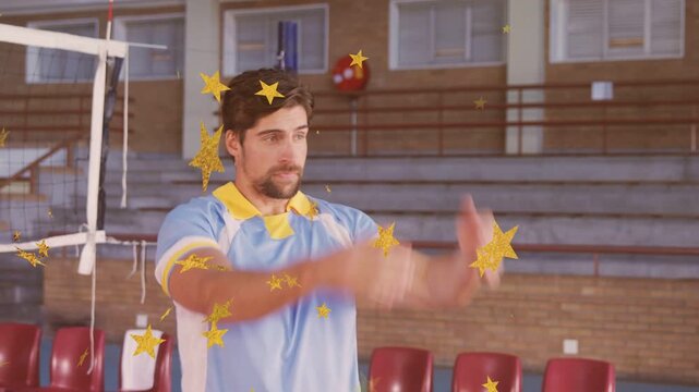 Male player starting hands back, swinging arms by volleyball net, gold stars overlaying, warming up