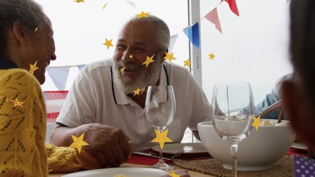 Senior man starting talk at table, holding her hand while gold stars floating, for lifestyle feast