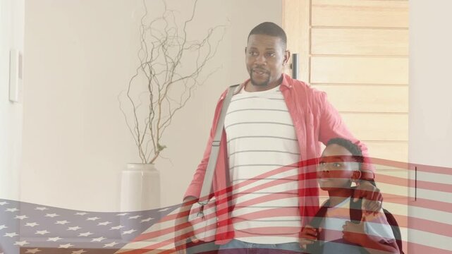 Dad opening door fixing bag holding son as mom entering hugging, flag overlaying reuniting family