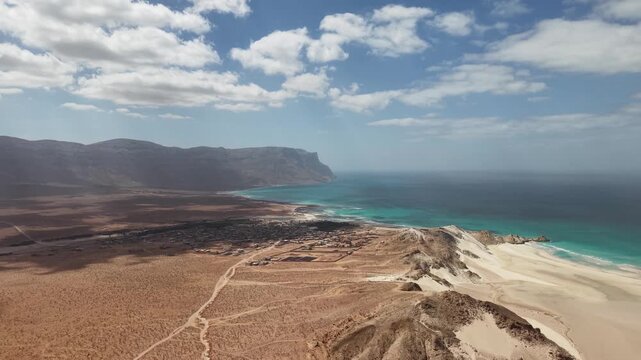 Aerial desert coastline with turquoise bay and sand dunes. Detwah Lagoon, Sokotra, Yemen.