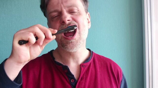 Adult man brushing teeth in bathroom, morning hygiene routine, fresh smile and healthy lifestyle concept.