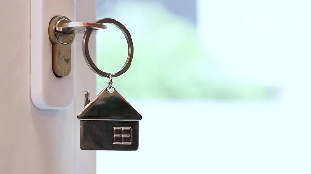 keys with house key ring on the door, real estate agency, buy house