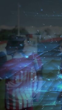 Vertical video: Teen soccer player talking sparking net overlay growing and showing links on pitch