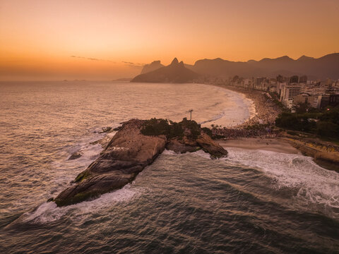 Beautiful aerial view to people watching the sunset from Arpoador