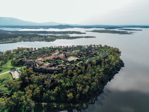 Aerial view of Granadilla walled village surrounded by lake