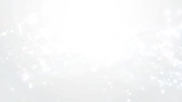 A serene video captures light on a white and light grey background with subtle texture.