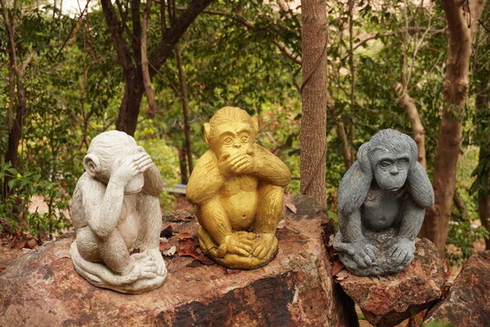 Three Wise Monkeys Stone Sculptures in Tropical Garden, Thailand