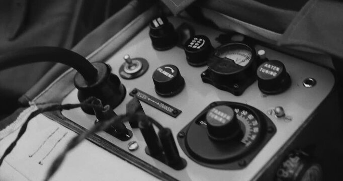 Black And White Video. Russian Soviet Infantry Red Army Soldier In World War II using Russian Soviet Portable Radio Transceiver In Trench Entrenchment In Spring Autumn Forest. 4K. Headphones And