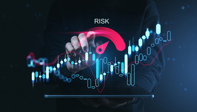Hand adjusting a bright risk gauge above glowing financial candlesticks with a futuristic trading interface and dynamic market indicators in a digital scene.