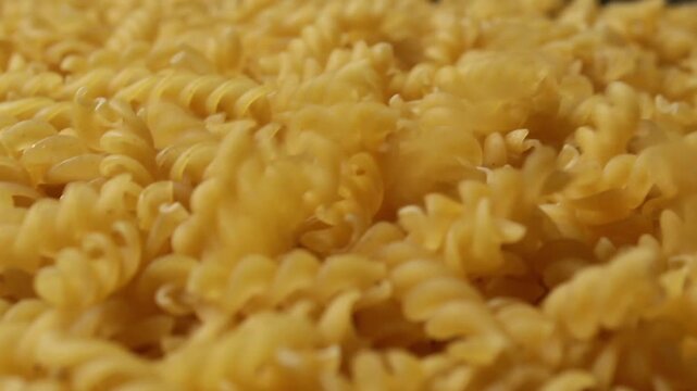 Close up of falling fusilli pasta