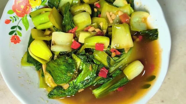 Delicious stir-fried Pak choi on a plate. It's perfect for culinary, product, hospitality, or advertising cinematography.