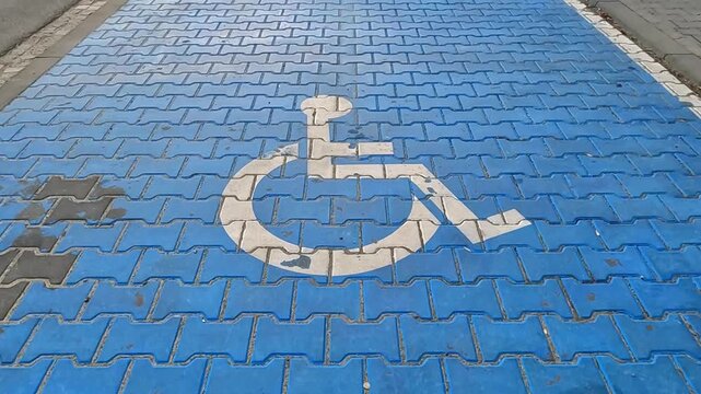 NOWY TARG, POLAND - APRIL 23, 2026: Blue-marked parking space for disabled persons.