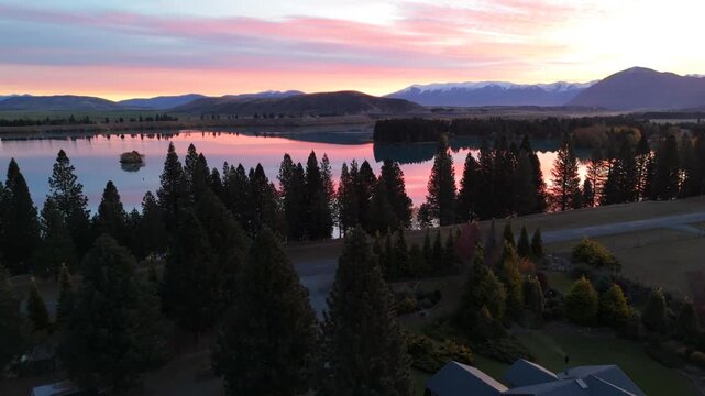 Aerial of Pink Sunset over Lake Twizel and Conifers