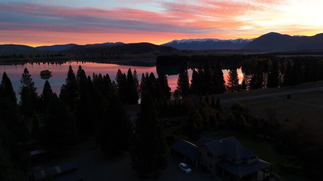 Aerial of Pink Sunset over Lake Twizel and Mountains