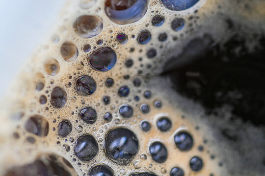 Macro detail of creamy coffee foam texture surface