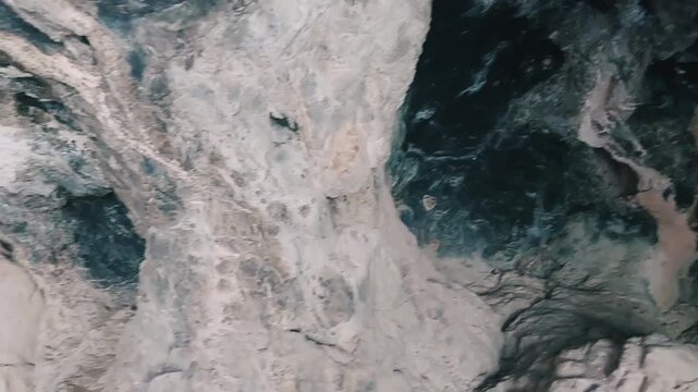 Exploring The Inner Rock Formations Of A Large Deep Cave