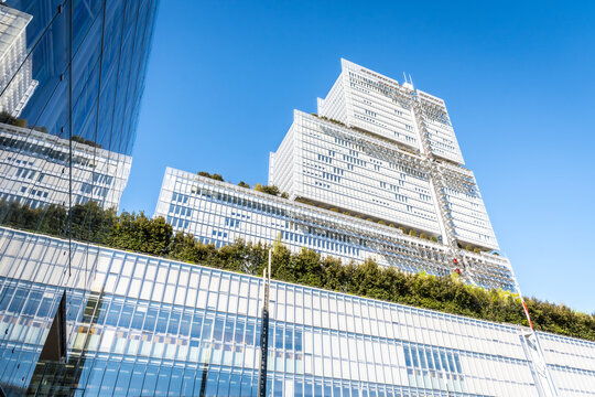 Paris, France - April 7, 2026: Low angle view of the "Tribunal de Paris" (Courthouse of Paris), a 38 storeys, 160 metres high building by architect Renzo Piano, seen from the Parvis Robert Badinter.