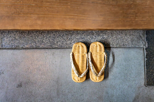 Traditional Japanese Sandals at Entrance of Wooden House