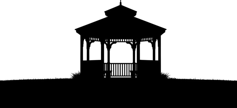 Traditional garden gazebo standing on a grassy horizon silhouette
