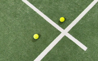 Fototapeta premium Ball Beside Tennis or Padel Net on Green Artificial Turf Court with White Line, Outdoor Sports Background with Copy Space