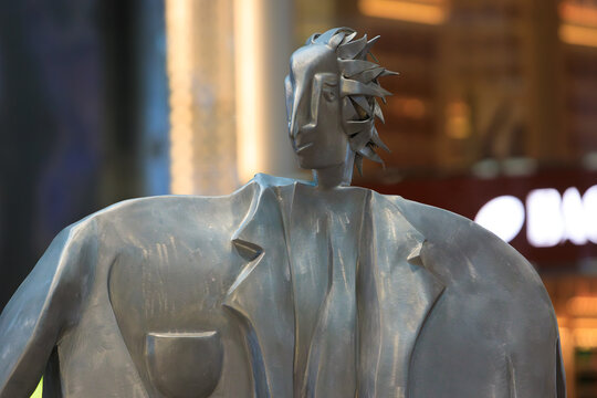 Singapore - 28 December, 2025: Portrait of Man from the sculpture Traveling Family at departure hall of Terminal 4 of Changi Airport Singapore. Medium: Aluminum, 2017. Artist Kurt Laurenz Metzler