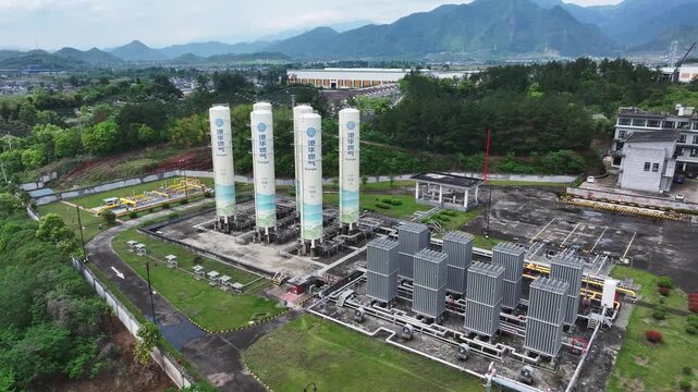 Natural gas storage tanks and compression equipment in an industrial plant area