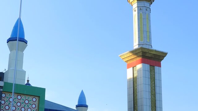 mosque tower with beautiful design against sky background