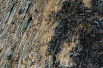 Naklejka premium Dark Volcanic Rock Texture Background - Natural Stone Surface Pattern