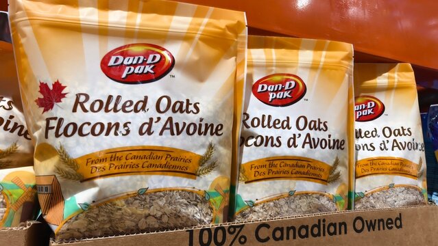 Dan D Pak rolled oats in resealable bags for sale at a supermarket shelf display