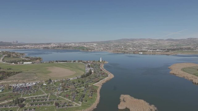Cinematic Drone Flight from Picnic Area and Lake Beacon Toward City View Over Mogan Lake in Ankara, Turkey