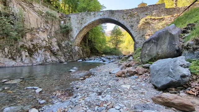 Old bridge on a creek in Lake Como alps