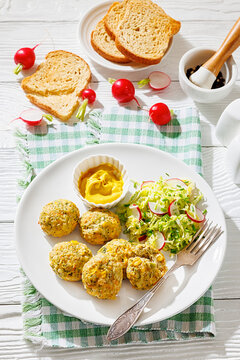 Baked meat and vegetable polpette with salad