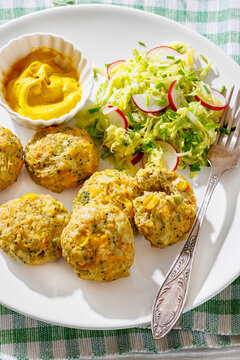 Baked meat and vegetable polpette with salad