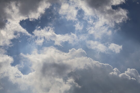 Bright clear sky with soft light and beautiful fluffy clouds creating a peaceful, airy atmosphere full of natural serenity.  Nature Beautiful blue sky