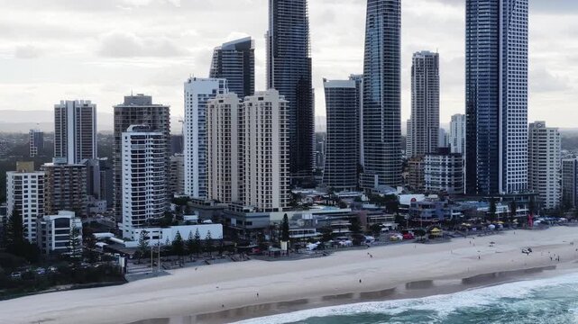 Zoom out from high-rise towers of Gold Coast Surfers Paraside waterfront &ndash; aerial.
