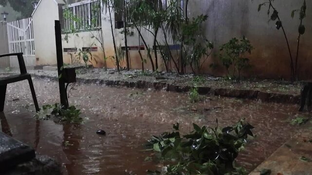 Bangalore, India, 18th April 2026: Severe Monsoon Rainstorm with Hailstorm and Strong Winds Blowing Across Urban Streets &ndash; Cloudy Sky Over Indian City Skyline During Heavy Rainy Weather