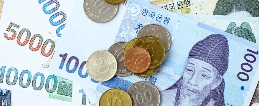 South Korean won money bills and coins on table. South Korea cash of KRW currency