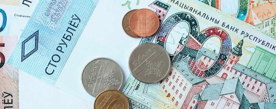 Belarusian ruble money bills and coins on table. Belarus cash of BYN currency close up
