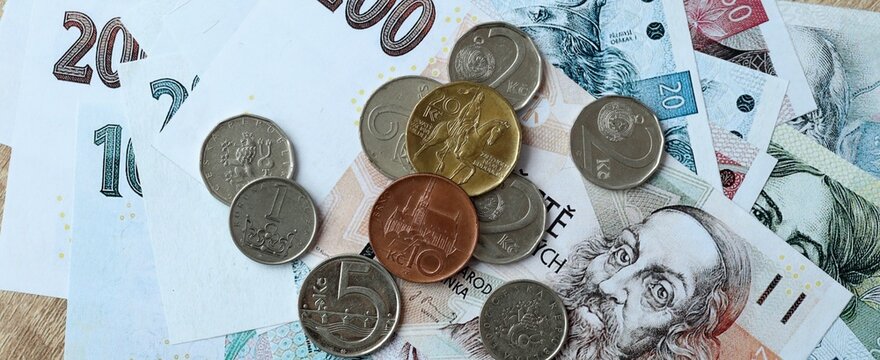 Czech koruna money bills and coins on table. Czech Republic cash of CZK currency close up