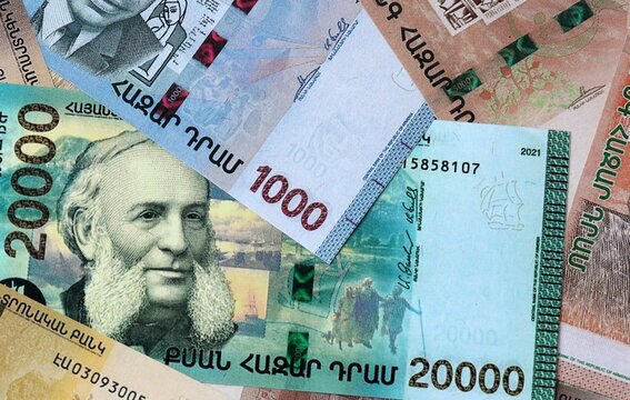 Armenian dram money banknotes bunch on table. Armenia bills of AMD currency close up