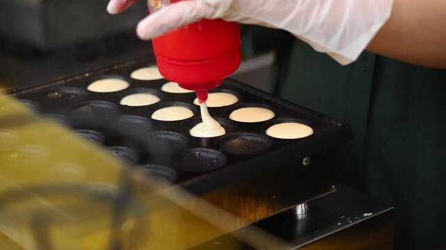 Making mini pancakes in a busy kitchen