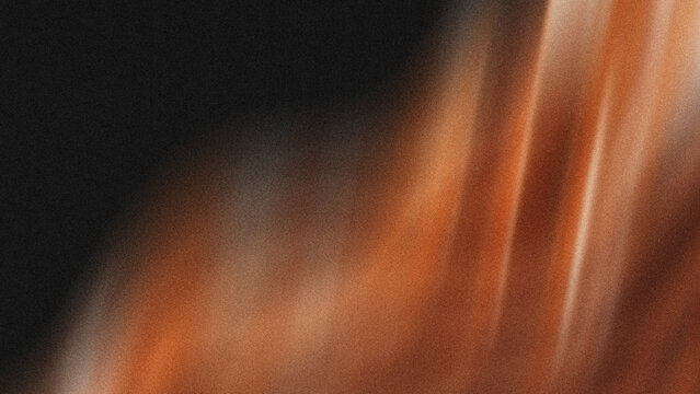 Abstract warm amber light rays blurring over dark textured background for artistic graphic design projects featuring soft glowing atmosphere and elegant motion blur effects with high quality film