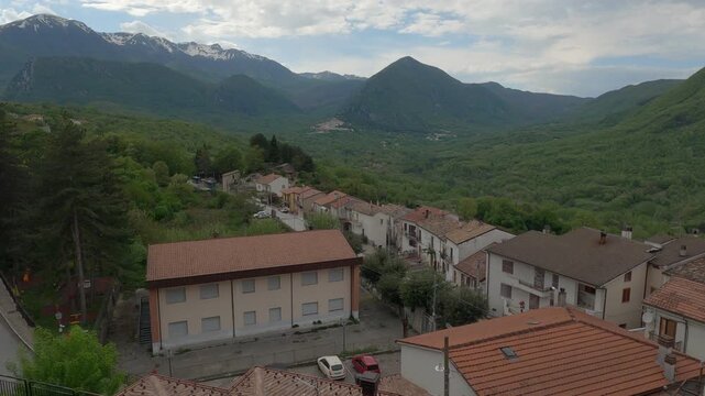 View of the small village of Castel San Vincenzo, with the Mainarde mountains in the background, Molise, Italy.