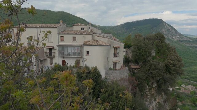 View of the small village of Castel San Vincenzo, with the Mainarde mountains in the background, Molise, Italy.