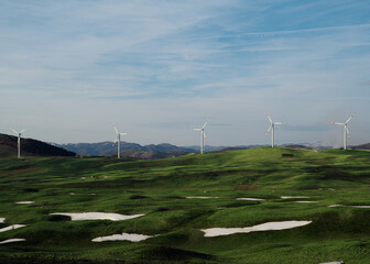 Fototapeta premium Wind farm in scenic mountains, clean energy production and eco technology
