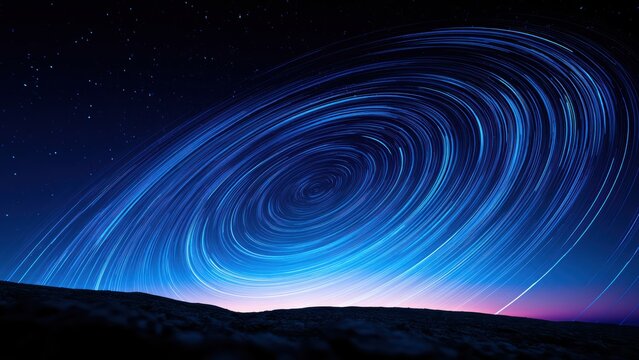 Vibrant celestial spiral of star trails illuminates the night sky, showcasing Earth's majestic rotation.