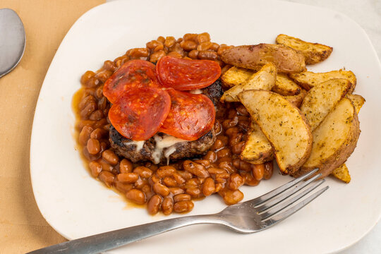 pizza burger  with baked beans and wedges