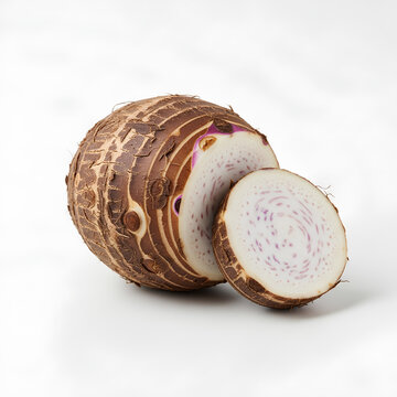 Closeup of sliced taro root on a white surface showcasing its texture.